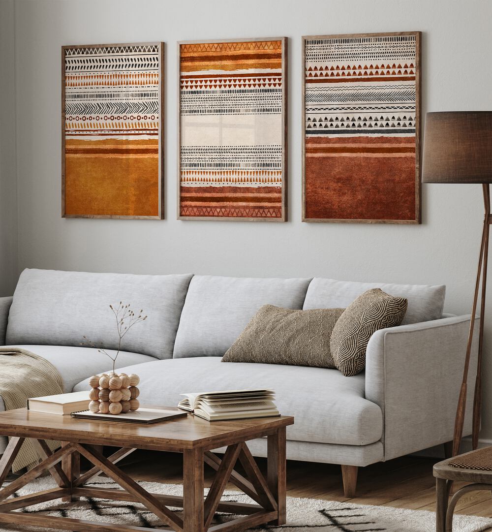 Organic Rug Patterns Set Of 3 Paintings in Oak Wood Plain Frame placed on a living room wall behind a sofa