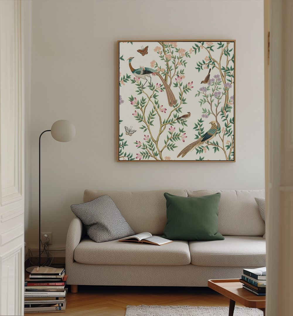 Peacocks And Birds In Flower Garden I Indian Art Painting Artwork in Oak Wood Floater Frame placed on a white wall behind a beige sofa in the living room