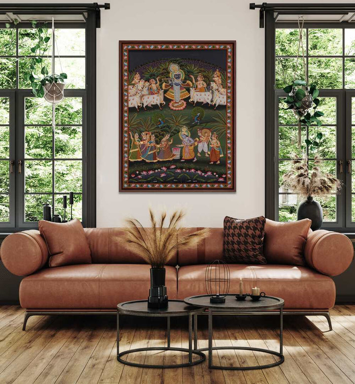 Pichwai Art I Indian Art Painting Artwork in oakwood floater frame on white wall behind a brown sofa for living room