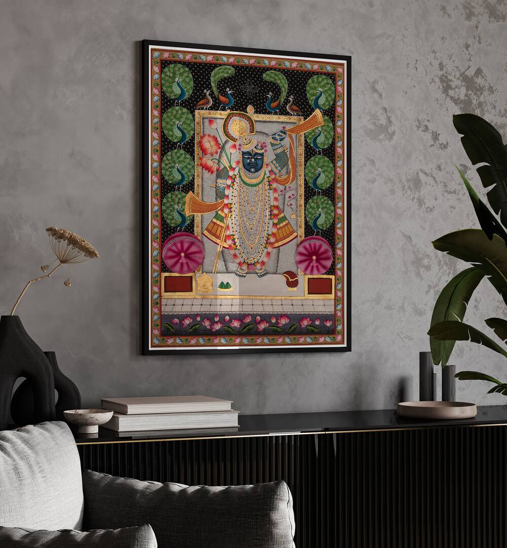 Pichwai Art II Indian Art Painting Artwork in Black Plain Frame placed on a grey Textured wall above a console Table