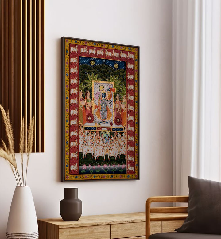 Pichwai Art III Indian Art Painting Artwork in black plain frame on white wall above a console table