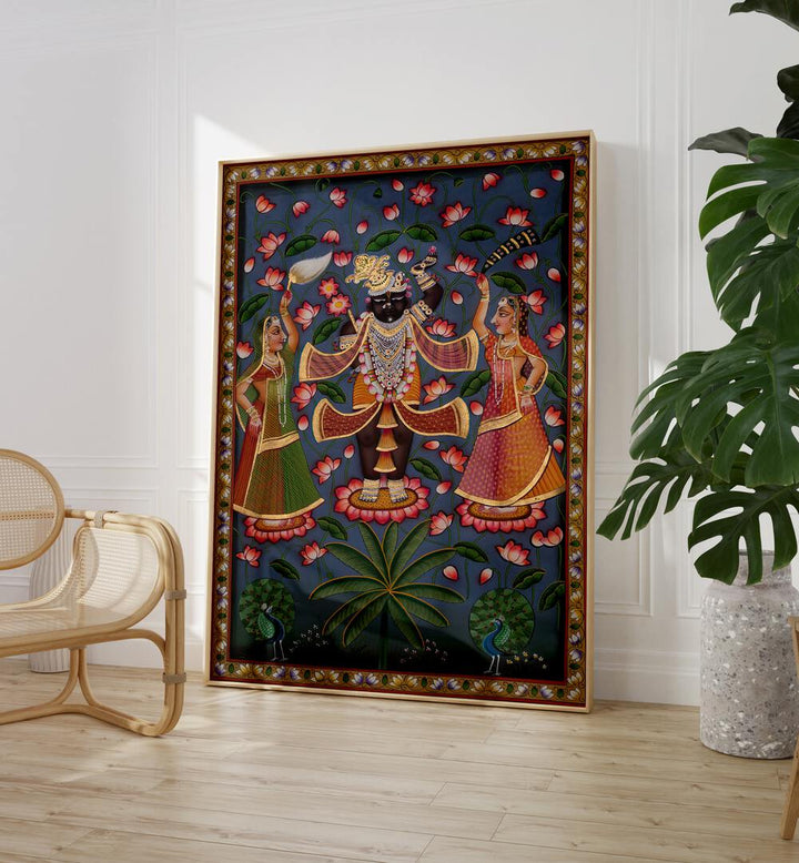 Pichwai Art V Indian Art Painting Artwork in oakwood floater frame beside a beige chair