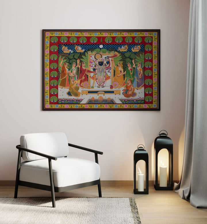 Pichwai Art VI Indian Art Painting Artwork in Black Plain Frame placed on a cream colored wall in the drawing room