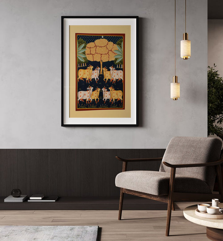 Pichwai Paintings Artwork Indian Art Painting Artwork in black frame with mount behind beige chair on grey wall