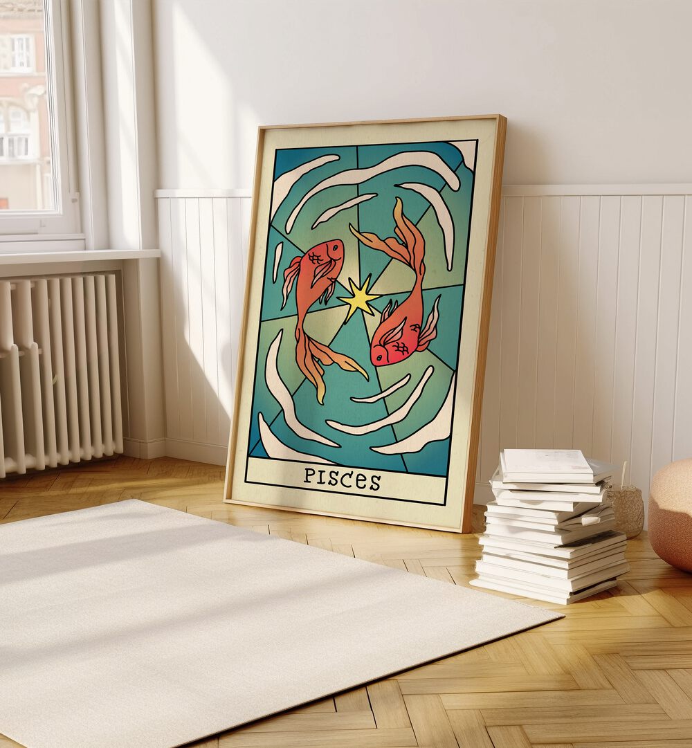 Pisces Zodiac & Tarot Art Painting Artwork in plain oakwood frame on a wooden floor beside a stack of books