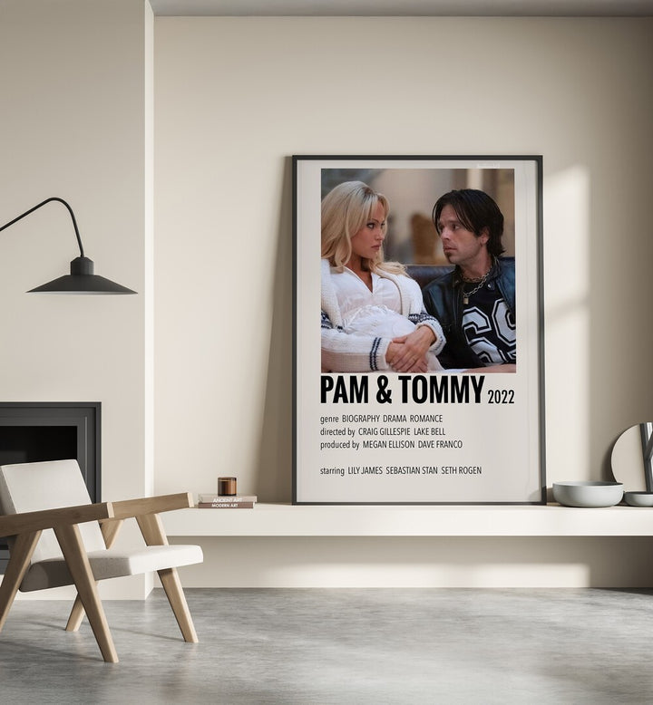 Pam Tommy 2022 Movie Posters in Black Plain Frame place on a wall behind a chair beside lamp
