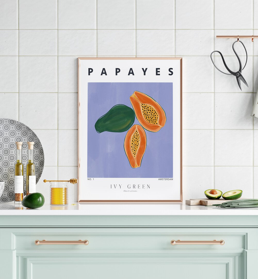 Papayes By Ivy Green Kitchen Art Prints in Oak Wood Plain Frame on a kitchen counter for kitchen area