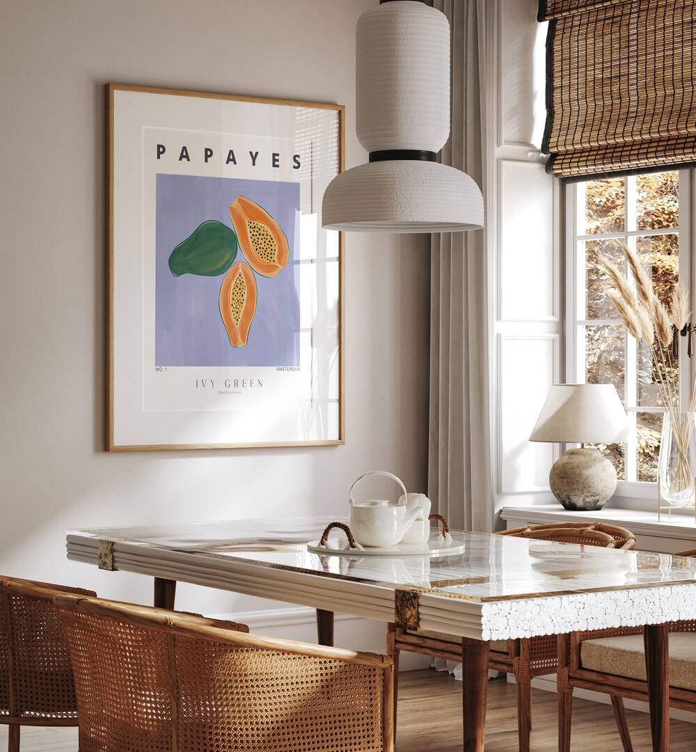 Papayes By Ivy Green Kitchen Art Prints in Oak Wood Frame With Mount on a white wall behind a dining table beside a window for dining area