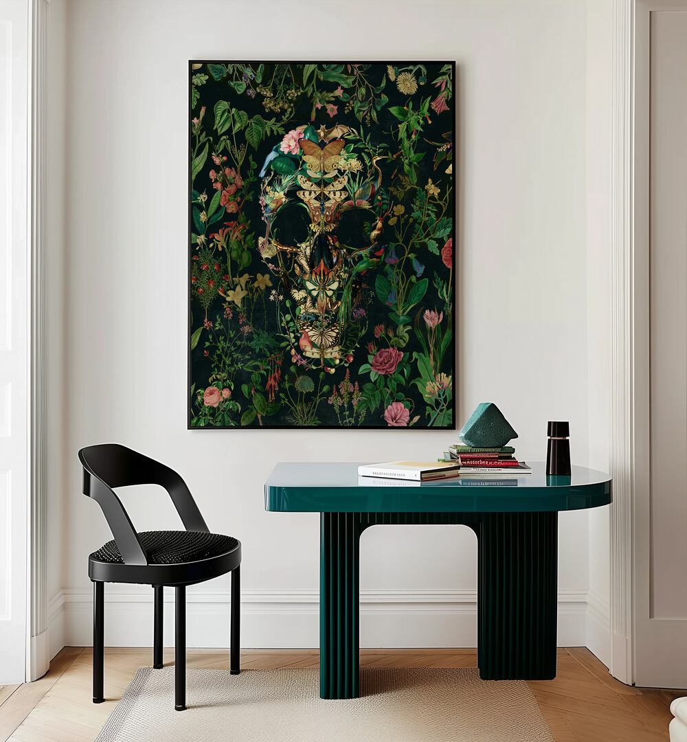 Papillon Skull Botanical Art Prints Floral Paintings in Black Plain Frame placed on a wall behind a study table