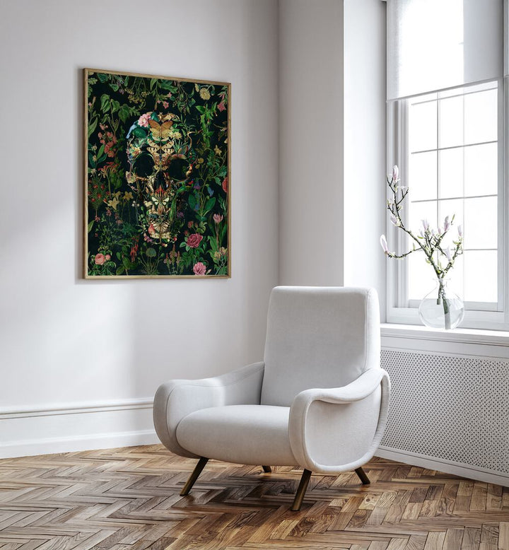 Papillon Skull Botanical Art Prints Floral Paintings in Oak Wood Plain Frame placed on the white wall beside a chair and a window