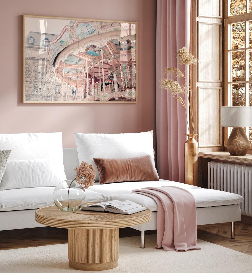 Paris Carousel I By Grace Digital Art Co Kids Room Prints in Oak Wood Plain Frame placed on a pink wall behind a sofa