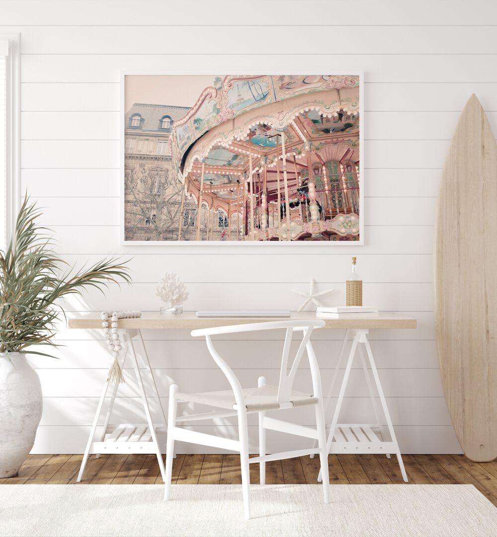 Paris Carousel I By Grace Digital Art Co Kids Room Prints in White Plain Frame placed on a wall behind a table which is beside a plant