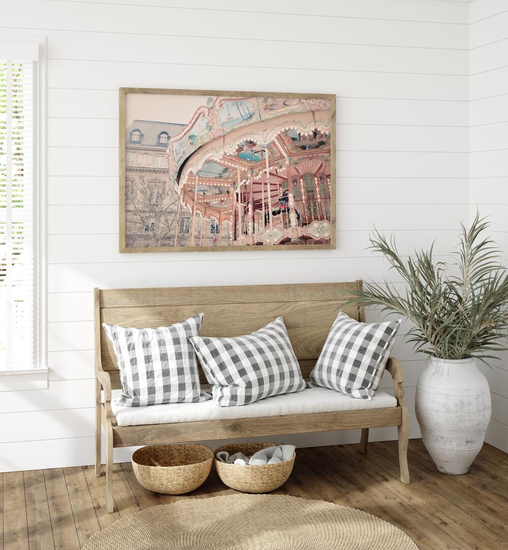 Paris Carousel I By Grace Digital Art Co Kids Room Prints in Oak Wood Plain Frame placed on a wall behind a sofa 