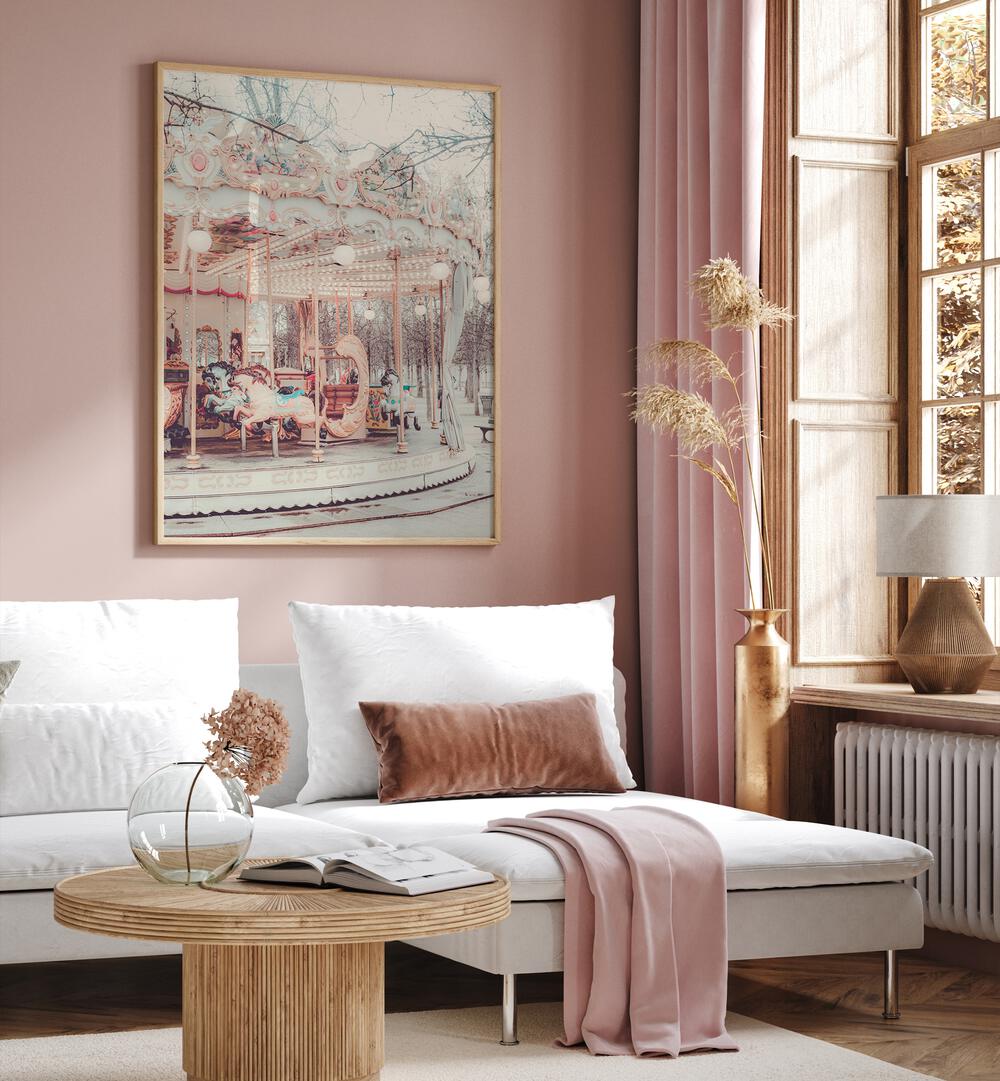 Paris Carousel iii By Grace Digital Art Co Kids Room Prints in Oak Wood Plain Frame placed on a pink wall behind a sofa