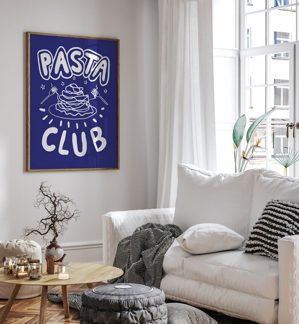 Pasta Club by Studio Dolci Kitchen Posters in Oak Wood Plain Frame placed on a wall beside a sofa and a window