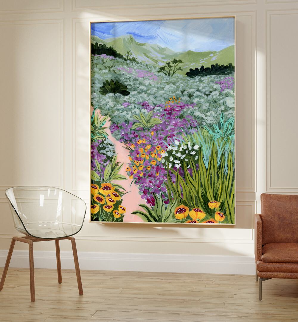 Path to the Pacific i By Sarah Gesek Landscape Art Prints in Oak Wood Plain Frame placed on a wall between a sofa and a chair