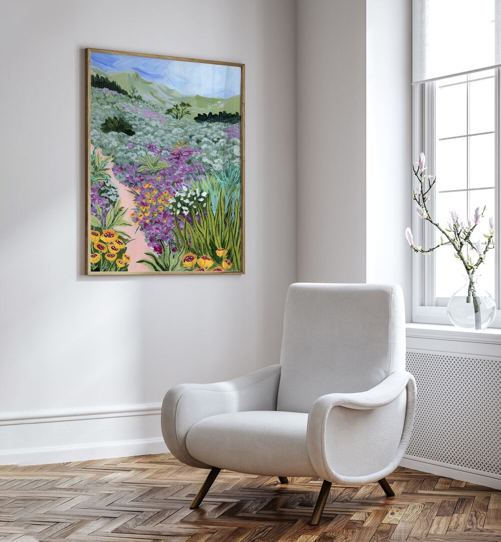 Path to the Pacific i By Sarah Gesek Landscape Art Prints in Oak Wood Plain Frame placed on a white wall beside a chair and a window