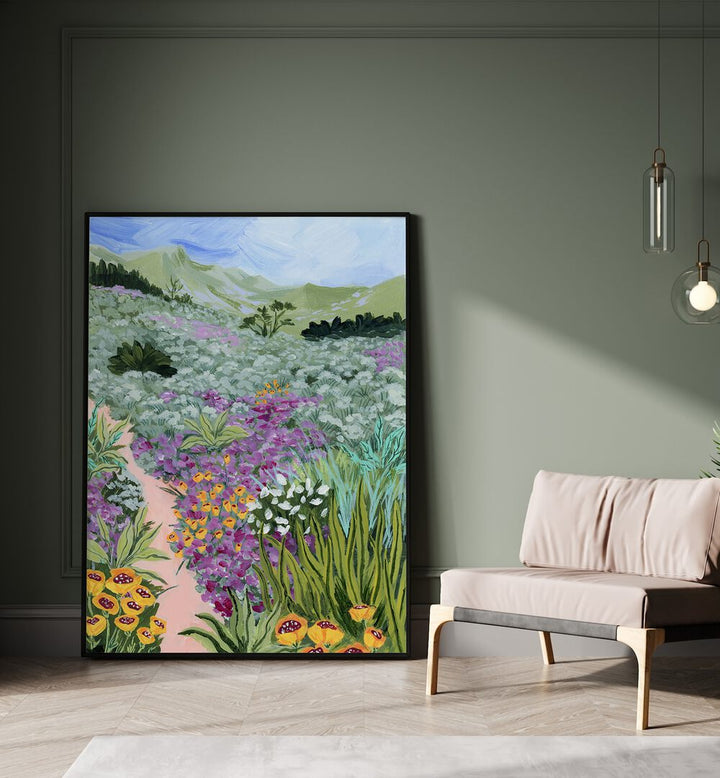 Path to the Pacific i By Sarah Gesek Landscape Art Prints in Black Plain Frame placed on the floor beside a sofa