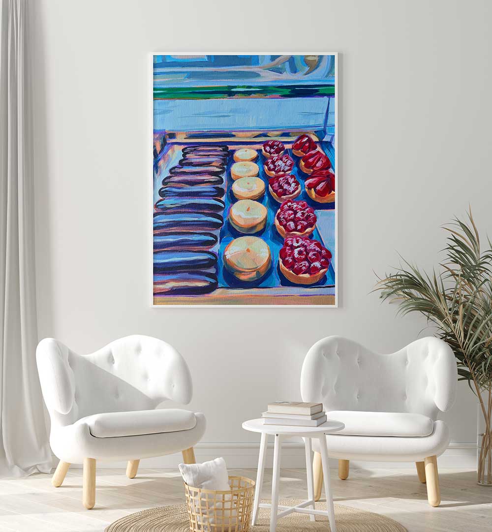 PÂTISSERIE , KITCHEN POSTERS showing framed French pastry art above white chairs in minimalist kitchen nook
