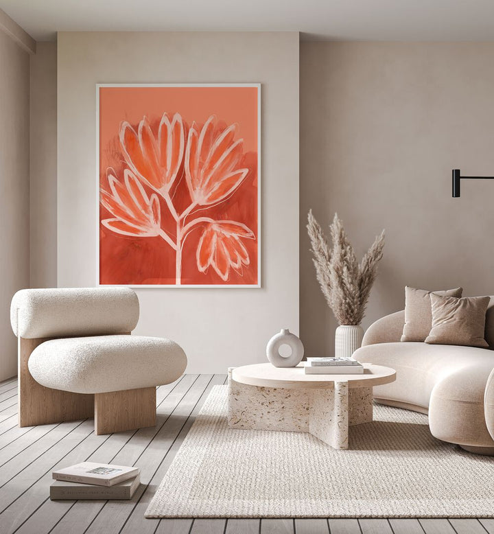 Peachy Flowers by Treechild Botanical Flower Paintings Floral Paintings in White Plain Frame placed on a wall in a living room behind a sofa