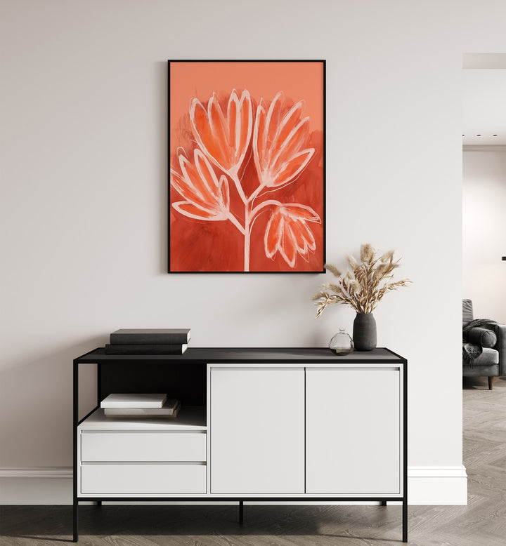 Peachy Flowers by Treechild Botanical Flower Paintings Floral Paintings in Black Plain Frame placed on a wall behind a black and white table