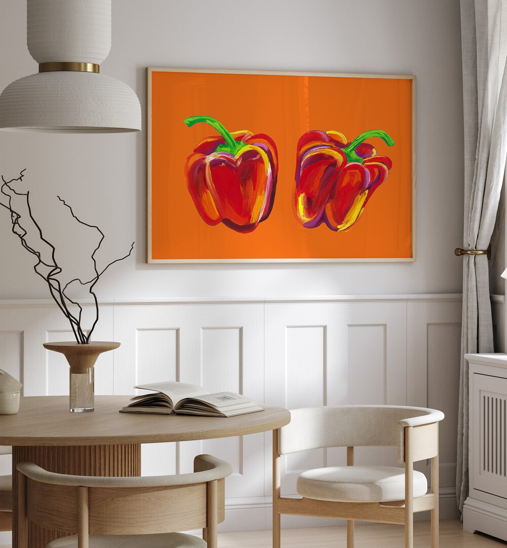 Peppers On Orange by Alice Straker Kitchen Posters Kitchen Art Prints in Oak Wood Plain Frame placed on a wall in a dining room area beside a window and behind a dining table