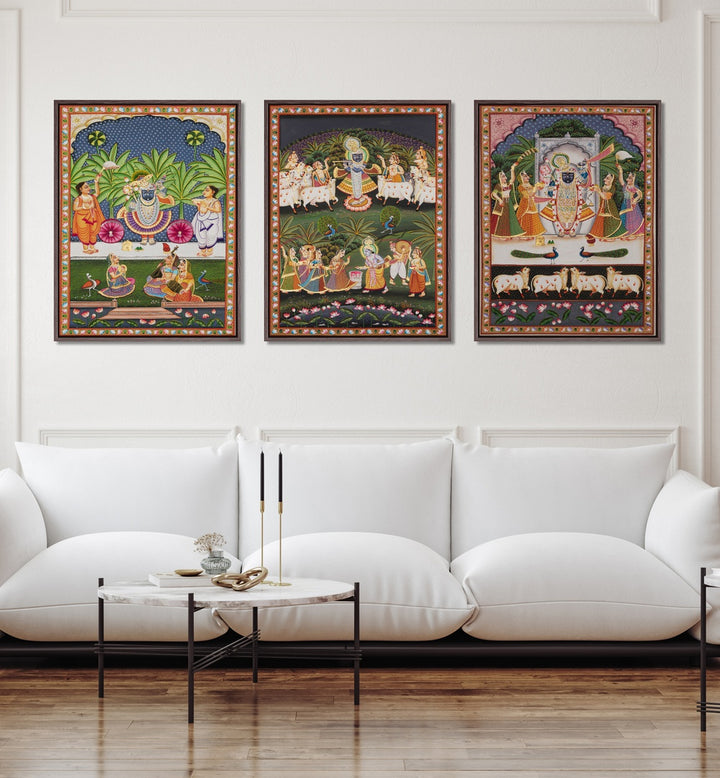 Pichwai Artworks Set Of 3 Paintings in Black Plain Frame placed on a wall living room wall behind a sofa