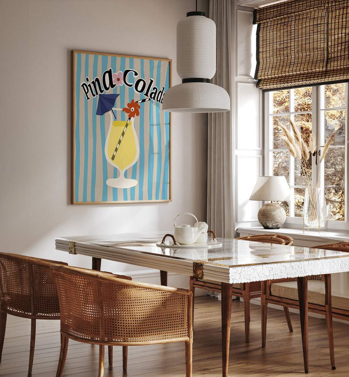 Pina Colada By Miho Art Studio Bar Posters Bar Art Prints in Oak Wood Plain Frame placed on a White Colored Wall near a Dining Table in the Dining Room