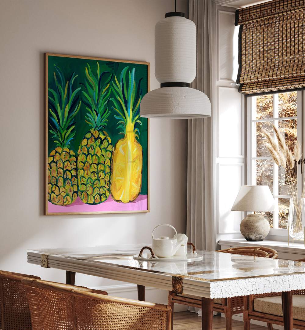 Pineapples  By Alice Straker Cafe Art Prints Cafe Posters in Oak Wood Plain Frame placed on a White Colored Wall near a Dining Table in the Dining Room