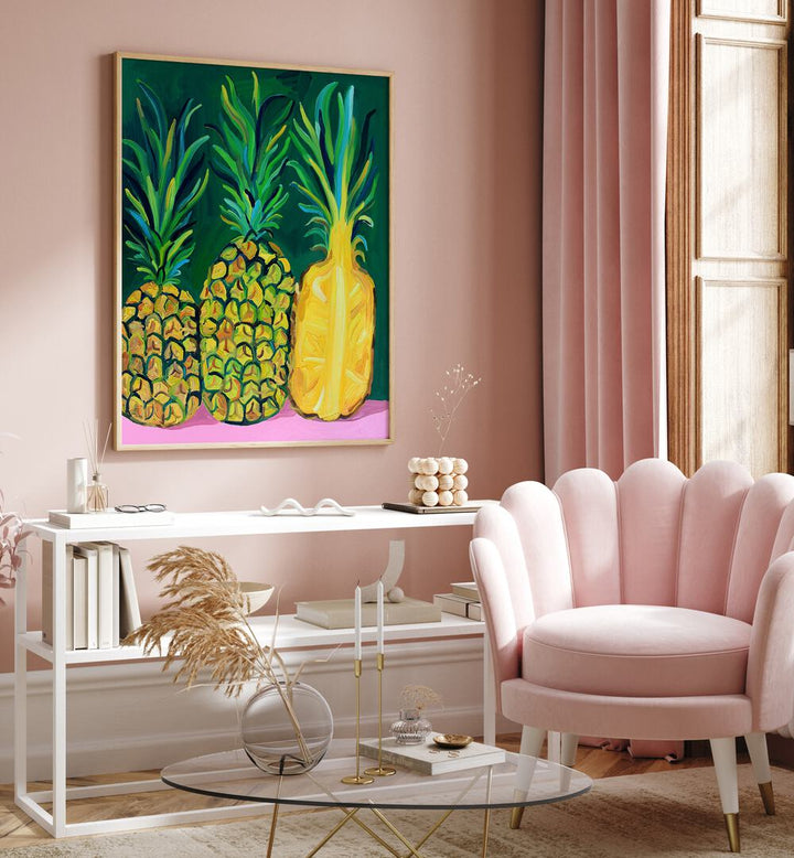 Pineapples By Alice Straker Cafe Art Prints Cafe Posters in Oak Wood Plain Frame placed on a Pink Colored Wall above a Console Table in the Drawing Room