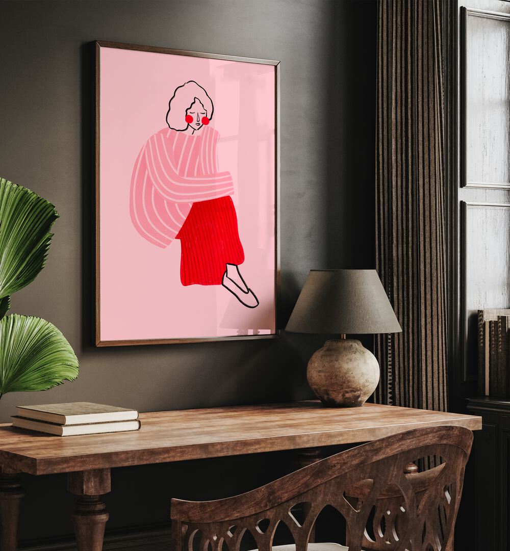 Pink And Red Line Lady By Bea Muller Women Illustration Paintings in Dark Wood Plain Frame on wall above a study table beside a plant