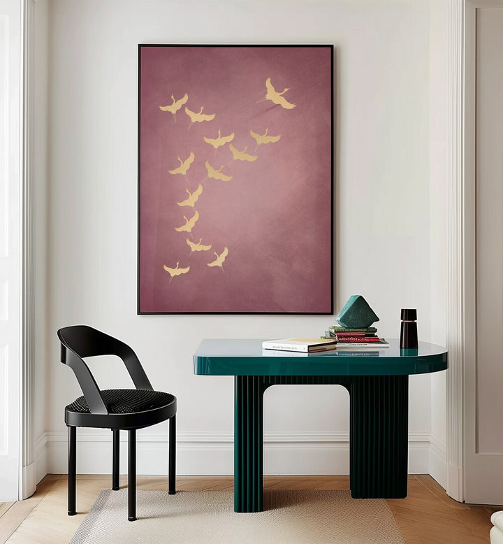 Pink Flying Cranes By Aureous Wildlife Art Prints in Black Plain Frame placed on a Cream Colored Wall near a Table in a Workspace in the Drawing Room