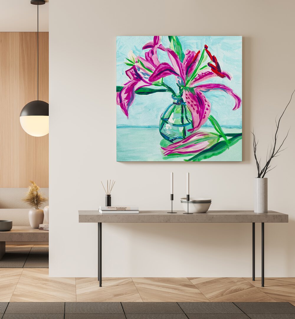 Pink Lilies By Key And Sea Creative Botanical Room Art in Gallery Wrap on a cream wall above a table