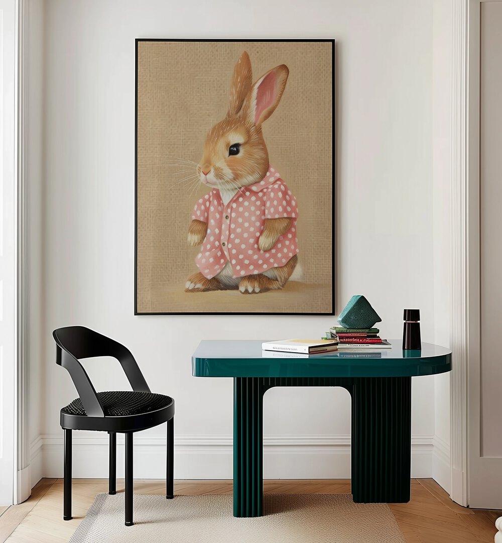 Pink Perfection Bunnys Style Kids Room Paintings Kids Room Wall Art in Black Plain Frame placed on a wall behind a study table