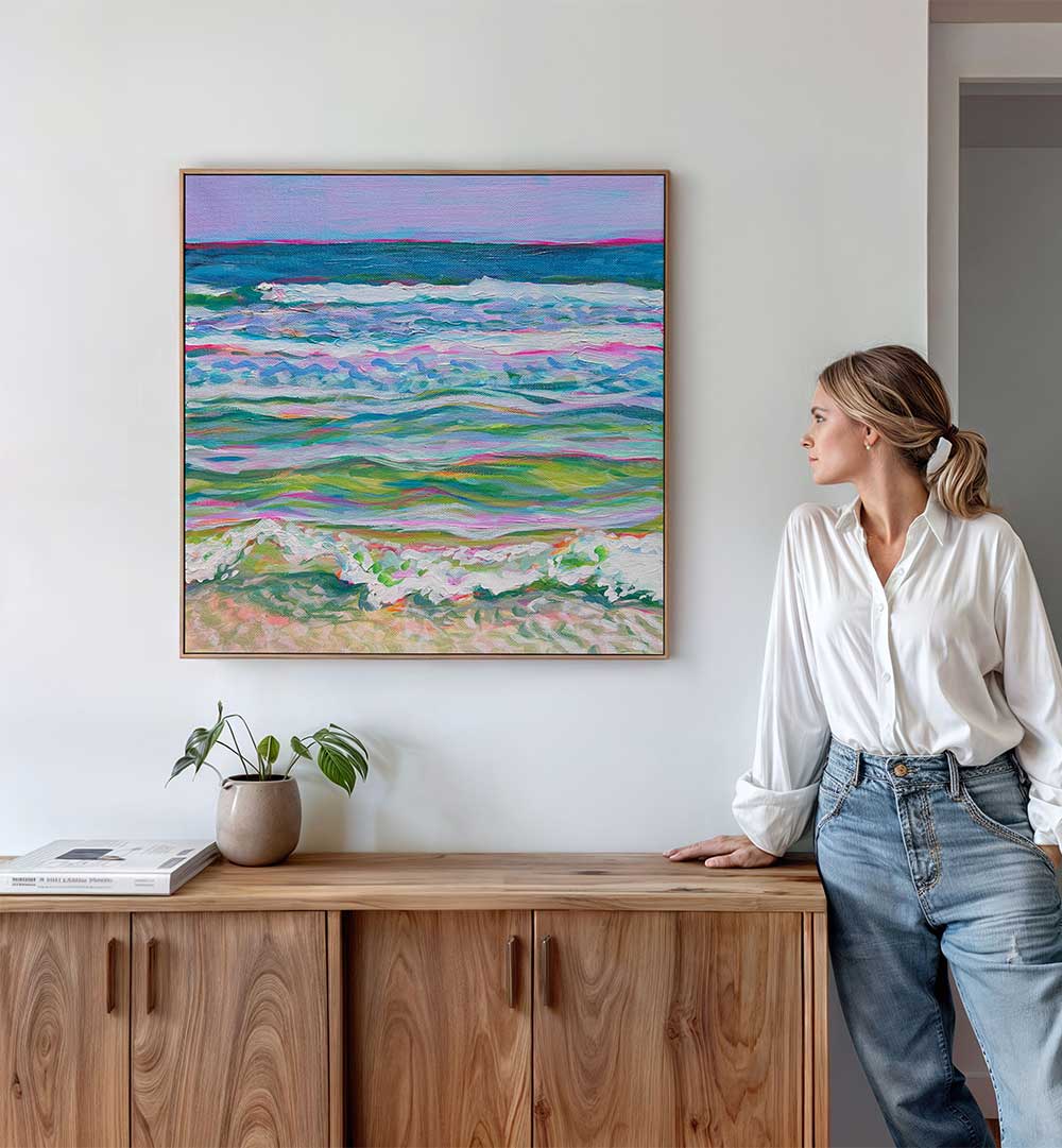 PINK SEAS , BEACH PAINTINGS pastel beach canvas in pink, coral and turquoise tones displayed above a wooden sideboard