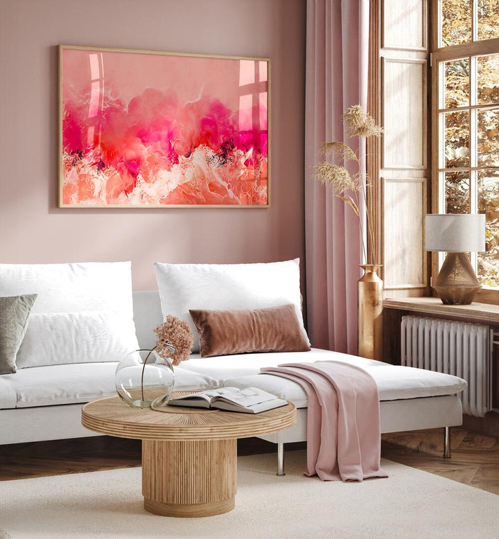 Pink Wave by Treechild Abstract Paintings Abstract Art Prints in Oak Wood Plain Frame placed on a living room wall behind a sofa and beside a window