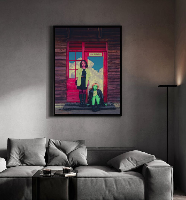 Pink and Green By Cosmo Zach Surreal Art Prints Surrealism in Black Plain Frame placed on a wall behind a sofa