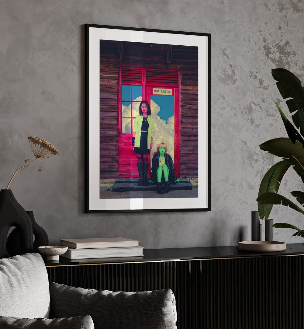 Pink and Green By Cosmo Zach Surreal Art Prints Surrealism in Black Frame With Mount placed on a wall behind a console table