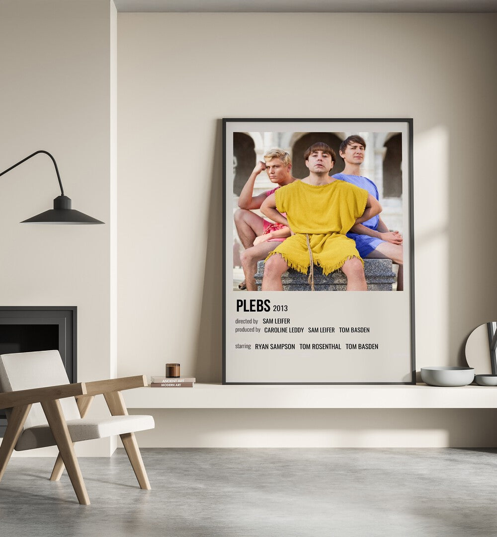 Plebs 2013 Movie Posters in Black Plain Frame place on a wall behind a chair beside lamp