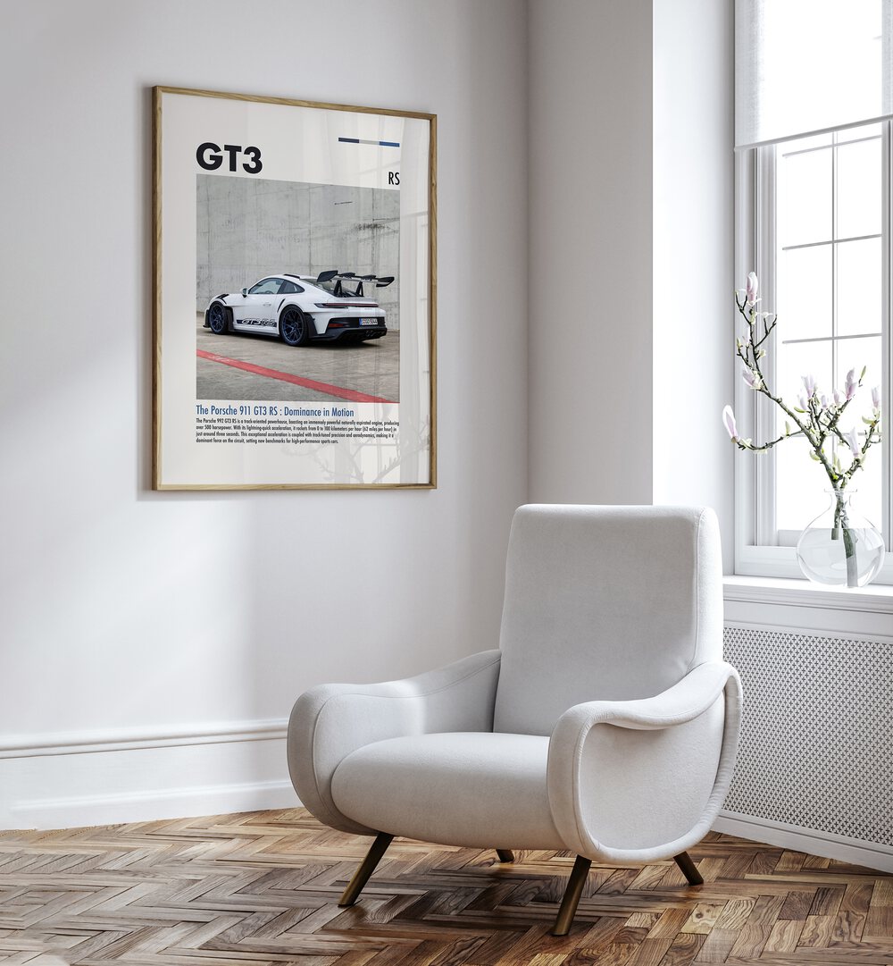 Porsche 911 GT3 RS Car Posters Automotive Wall Art Prints in Oak Wood Plain Frame placed on a White Colored Wall near a White Sofa Chair in the Drawing Room