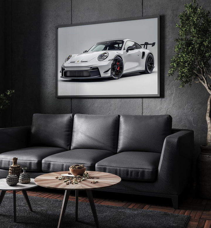 Porsche Creative IX Car Posters Automotive Wall Art Prints in Black Plain Frame placed on a Dark Grey Colored Wall near a Black Sofa in the Living Room