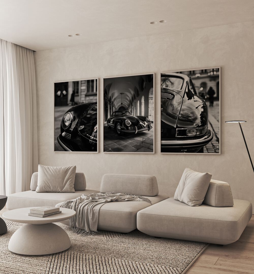 Porsche Set Set Of 3 Paintings in Oak Wood Plain Frame placed on a living room wall behind a sofa 