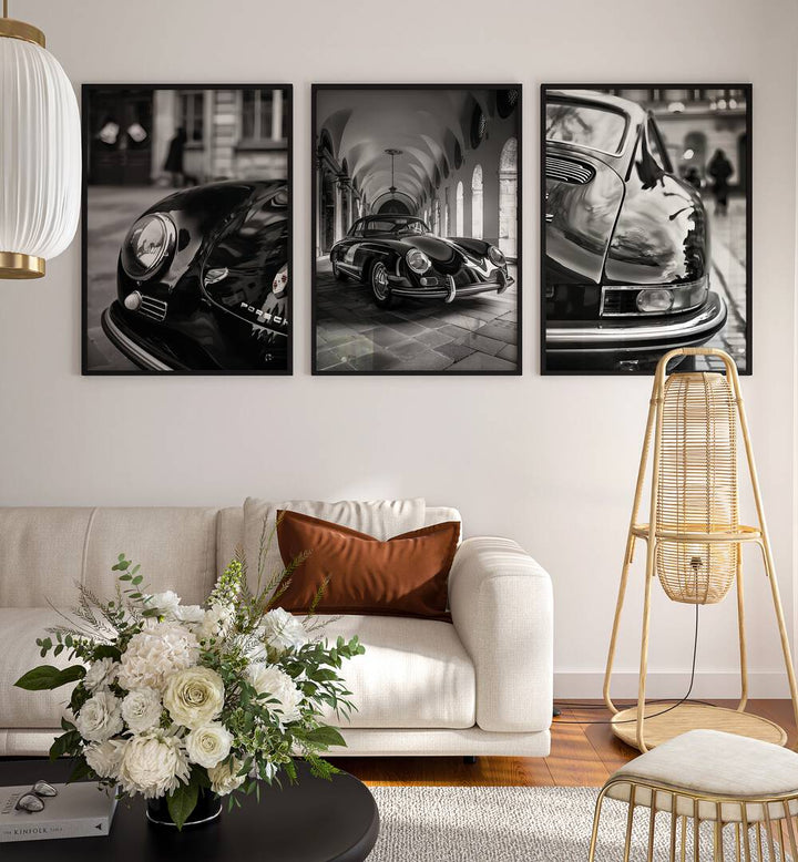 Porsche Set Set Of 3 Paintings in Black Plain Frame placed on a white wall behind a white sofa