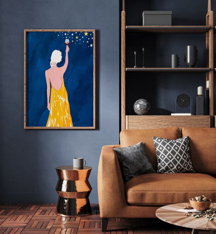 Pour Me Some Magic By Uma Gokhale Woman Illustration Paintings in Oak Wood Plain Frame on a blue wall beside a sofa