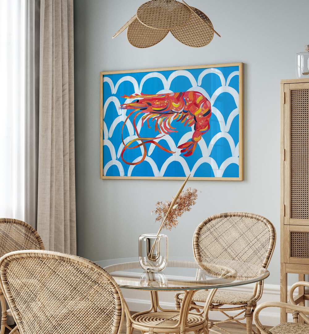 Prawn on Blue Wavey by Alice Straker Cafe Art Prints Cafe Posters in Oak Wood Floater Frame placed on a wall in a dining room area beside a window and behind a dining table