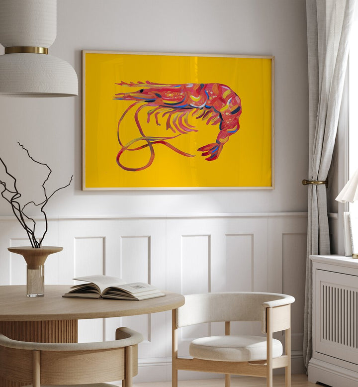 Prawn on Yellow by Alice Straker Cafe Art Prints Cafe Posters in Oak Wood Plain Frame placed on a wall in a dining room area beside a window and behind a dining table