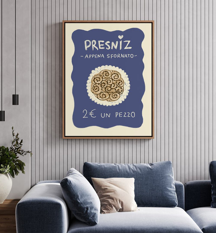 Presniz Up by Studio Dolci Kitchen Posters in Oak Wood Floater Frame placed on a wall behind a sofa