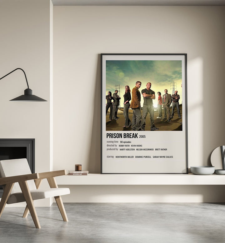 Prison Break 2005 Movie Posters in Black Plain Frame place on a wall behind a chair beside lamp