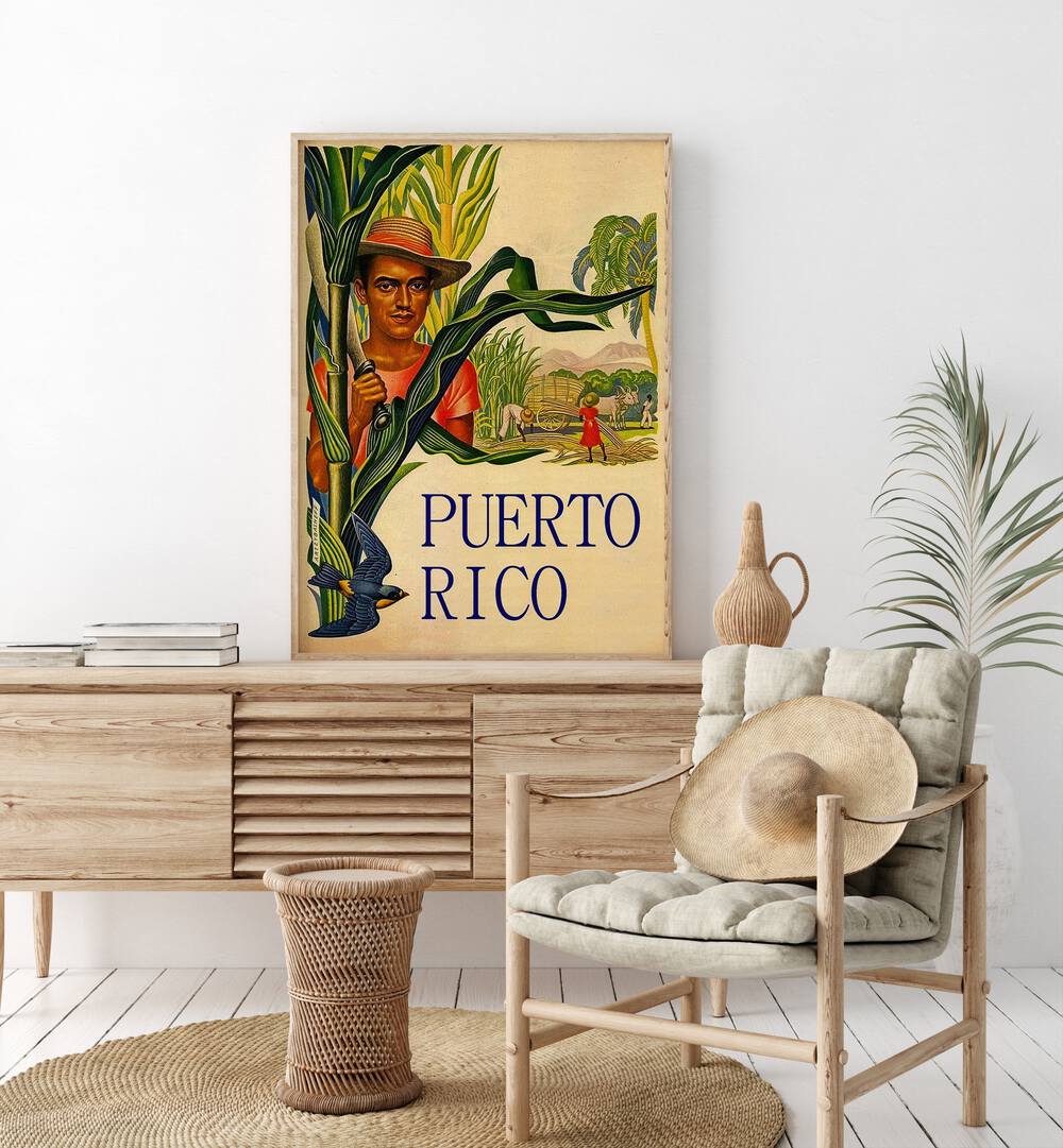 Puerto Rico  Travel Posters in Oak Wood Plain Frame placed on a console table behind a chair