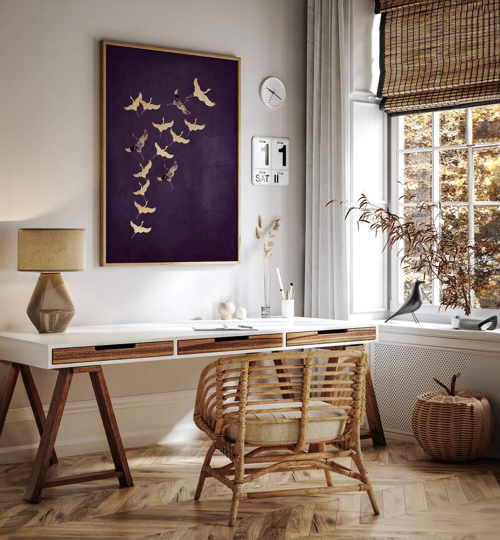 Purple Flying Cranes By Aureous Wildlife Art Prints in Oak Wood Plain Frame placed on a White Colored Wall near a Study Table in the Drawing Room